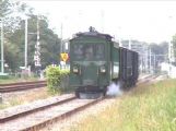 Nákladný vlak prepravujúci cestujúcich vyráža z Hoornu a vydáva sa na cestu do Wognumu