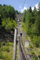 Parc d´Atractions: pohled na dolní úsek nejstrmější lanovky na světě- vpravo zbytky potrubí z vodní nádrže Emosson do elektrátny z roku 1920	. 23.8.2011	 © Lukáš Uhlíř