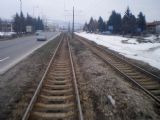 Sarajevo: typický tramvajový svršek v okolí zastávky STUP- koleje visí nad zemí, štěrk z 80. let už je vymletý	9.3.2012	 © Jan Přikryl