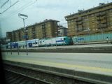 Souprava patrových vozů Vivalto v čele s elektrickou lokomotivou řady E464 Trenitalie stojí s regionálním vlakem ve stanici Firenze Rifredi	26.4.2013	 © 	Jan Přikryl